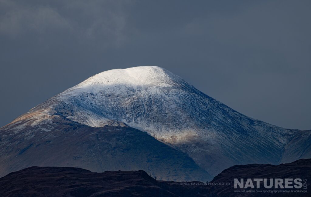 A view of a snow covered Ben More the only mountain on Mull photographed by Neil Davidson during one of the NaturesLens photography Holidays to the Isle of Mull